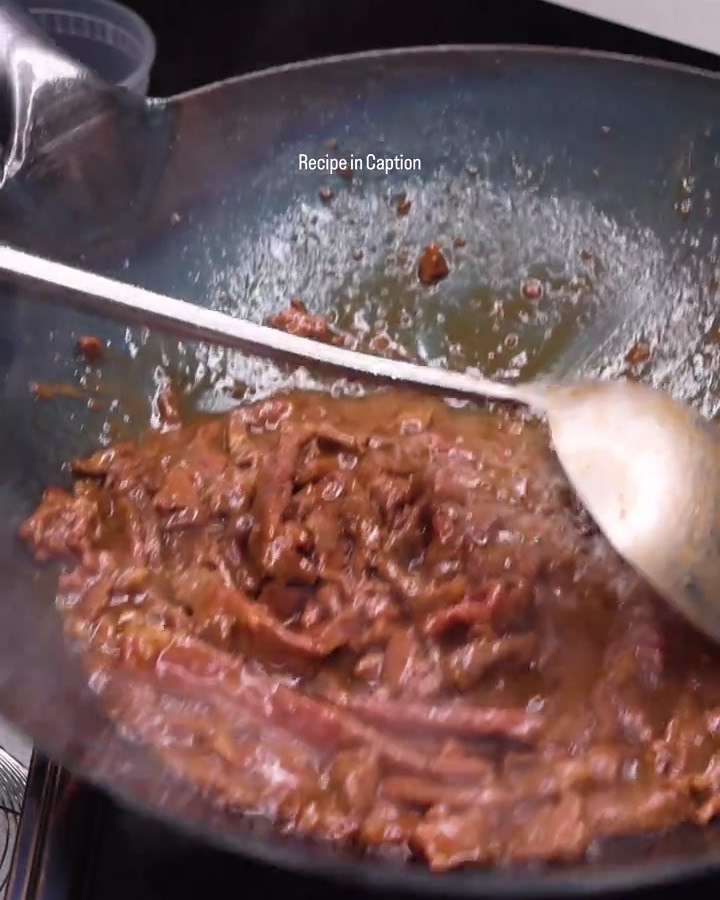 Beef bulgogi cooking in a wok, a still from my reel for Yosukata